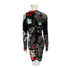 Long-sleeve dress with floral and paisley patterns on a mannequin against a white background