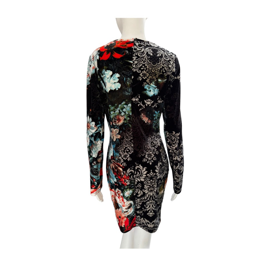 Long-sleeve dress with floral and paisley patterns on a mannequin against a white background