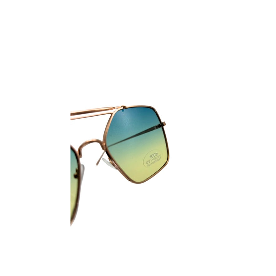Sunglasses with gold frame and gradient green lenses on a white background