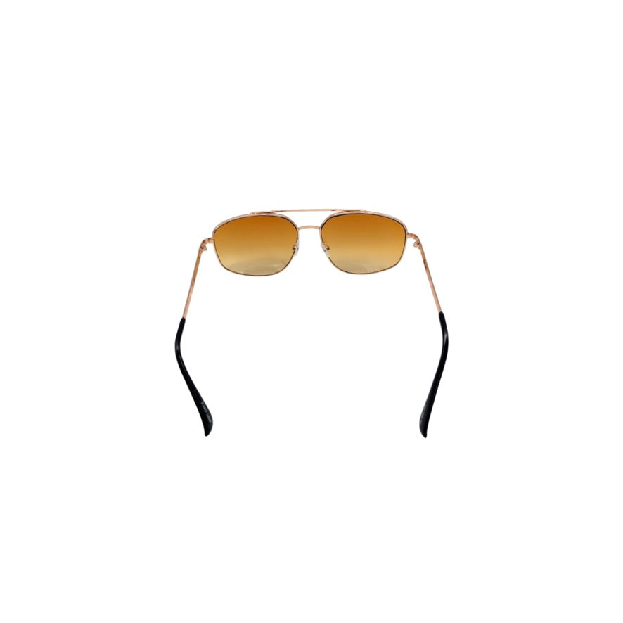 Sunglasses with gold frame and orange-tinted lenses on a white background