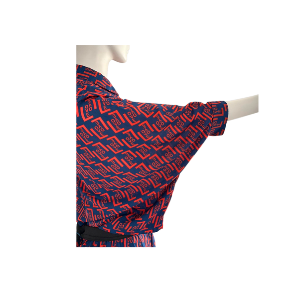 Red and blue patterned fabric on a mannequin with a white background