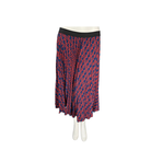 Long patterned skirt on a mannequin against a white background
