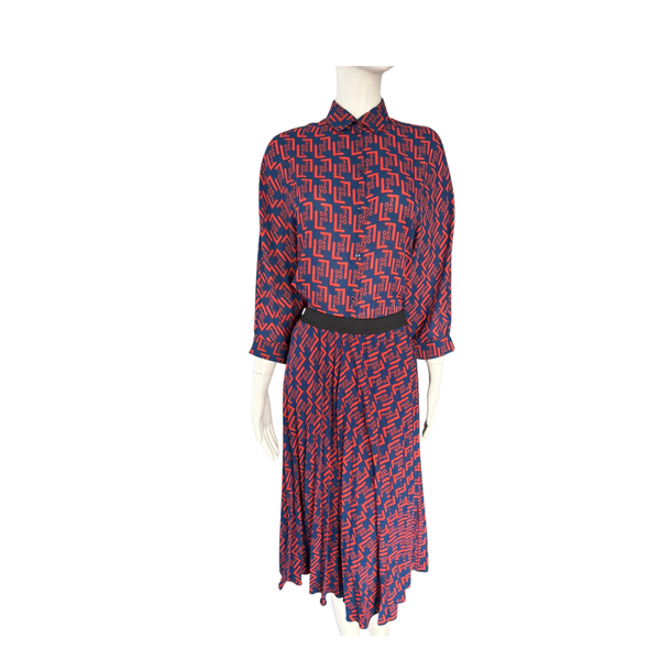 Red and blue patterned dress on a mannequin against a white background