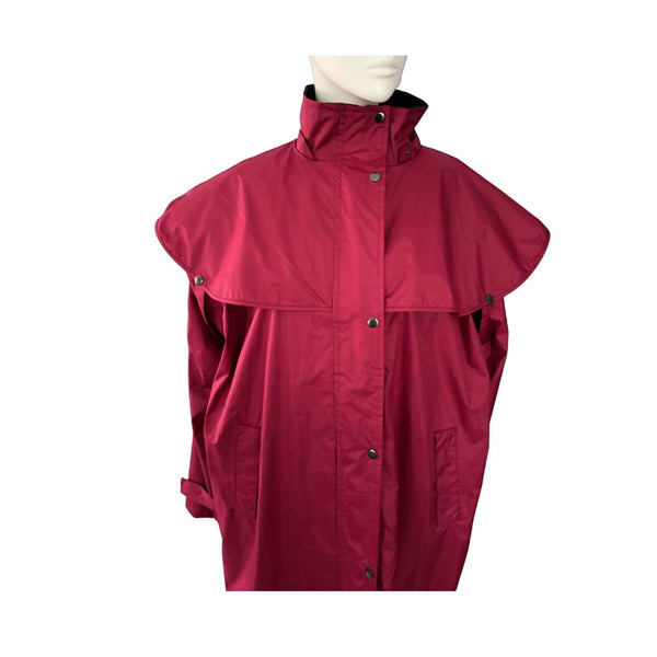 Red raincoat on a mannequin against a white background