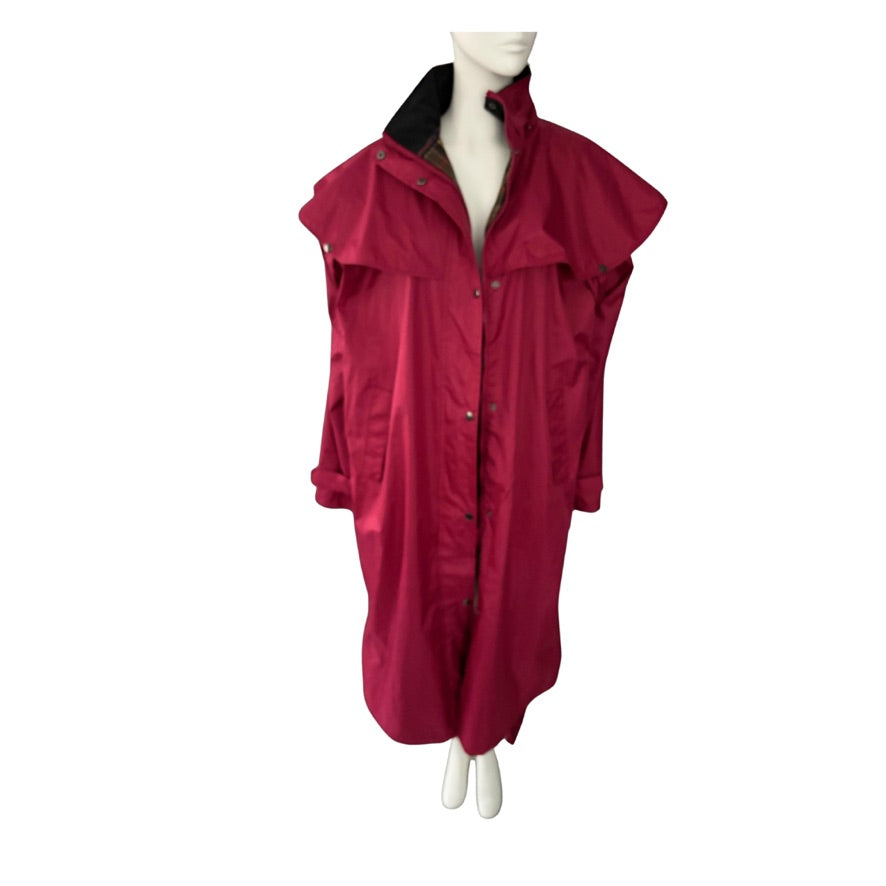 Red raincoat on a mannequin against a white background