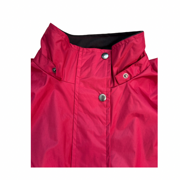 Close-up of a red jacket with buttons on a white background