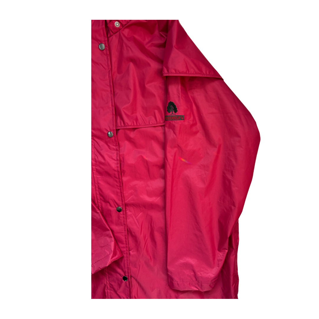 Close-up of a red jacket with a brand logo on a white background