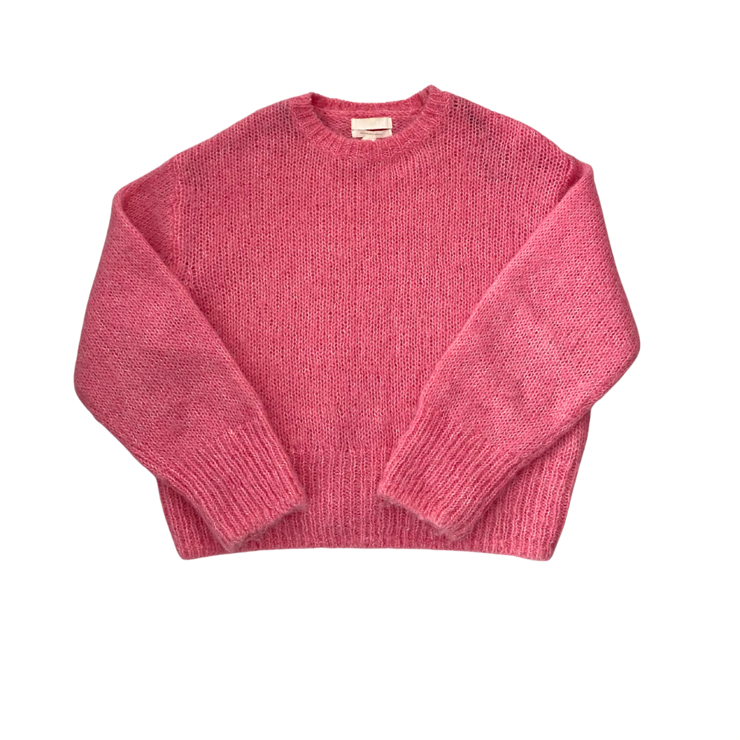 Pink sweater on a white background
