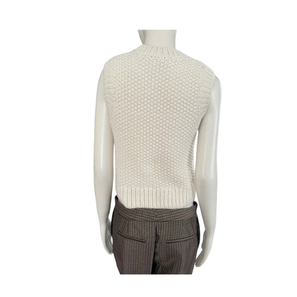 Mannequin wearing a cream knitted vest and brown plaid pants on a white background