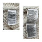 Close-up of fabric care labels on a textured white fabric background