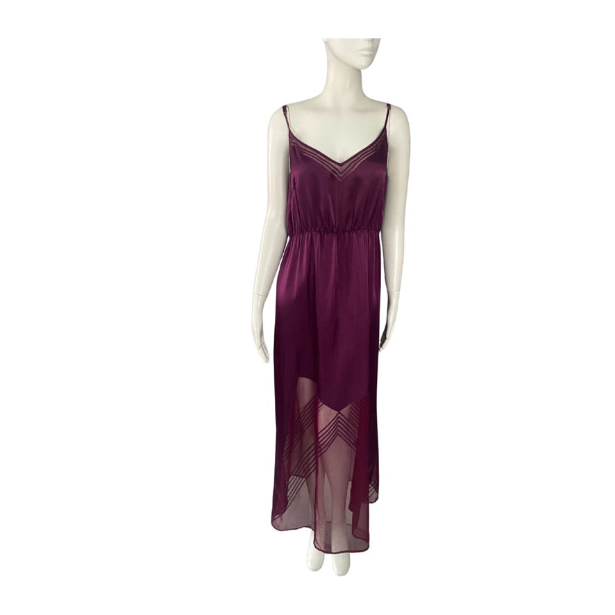 Mannequin wearing a burgundy dress with sheer panels on a white background