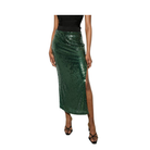 Green sequin skirt worn by a person on a white background