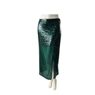 Green sequin skirt on a mannequin against a white background