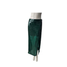 Green sequin skirt on a mannequin against a white background