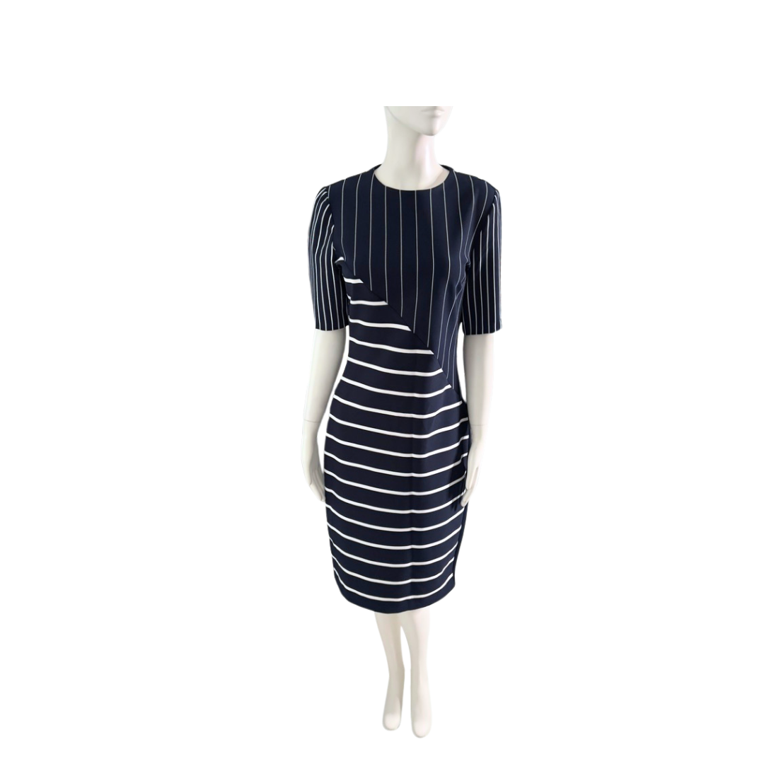 Navy and white striped dress on a mannequin against a white background