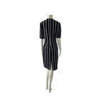 Mannequin wearing a navy and white striped dress on a white background
