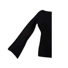 Black ribbed knit dress with wide sleeves on a white background