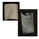 Close-up of a H&M label on fabric with text and symbols.