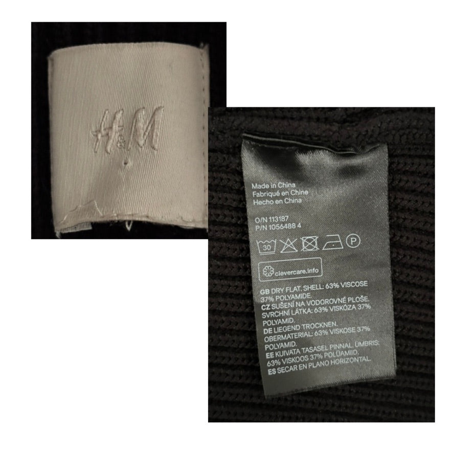 Close-up of a H&M label on fabric with text and symbols.