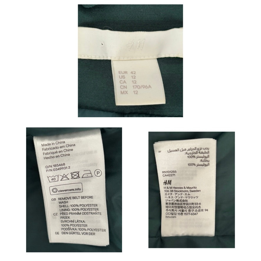 Close-up of H&M clothing labels on a green fabric background