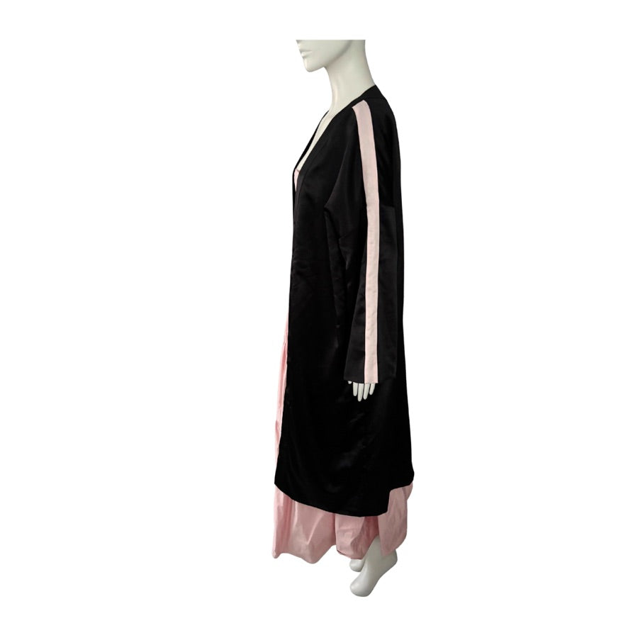 Black kimono with pink accents on a mannequin against a white background
