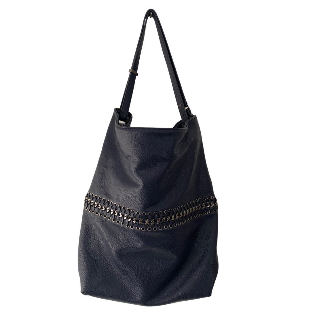 A dark navy faux leather tote bag with chain-link detailing and a whipstitched chain circumference. It features a long shape, a full zip fastening, and silver hardware.