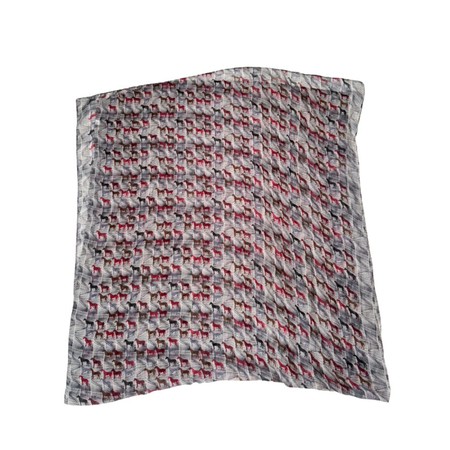 Horse Patterned fabric with red and black shapes on a white background