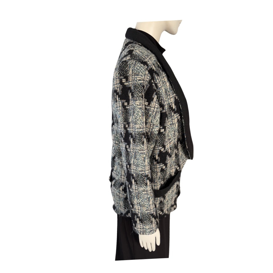 Mannequin wearing a patterned jacket on a white background