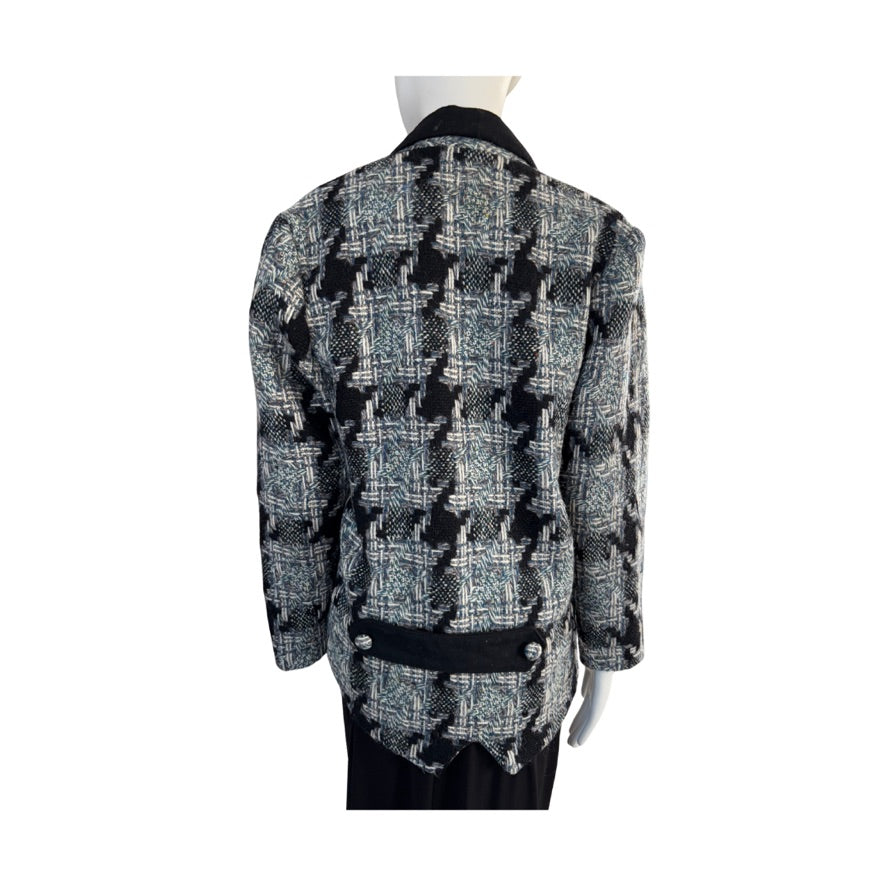 Houndstooth patterned jacket on a mannequin against a white background