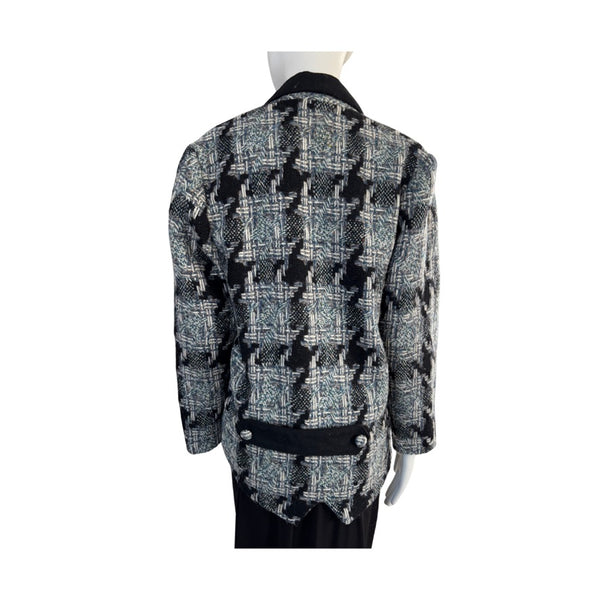 Houndstooth patterned jacket on a mannequin against a white background
