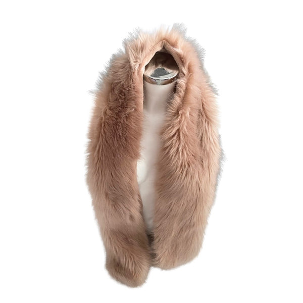 Light brown fur stole on a mannequin against a white background