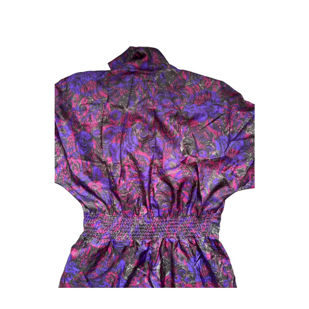 Close-up Multicolored patterned jumpsuit on a white background