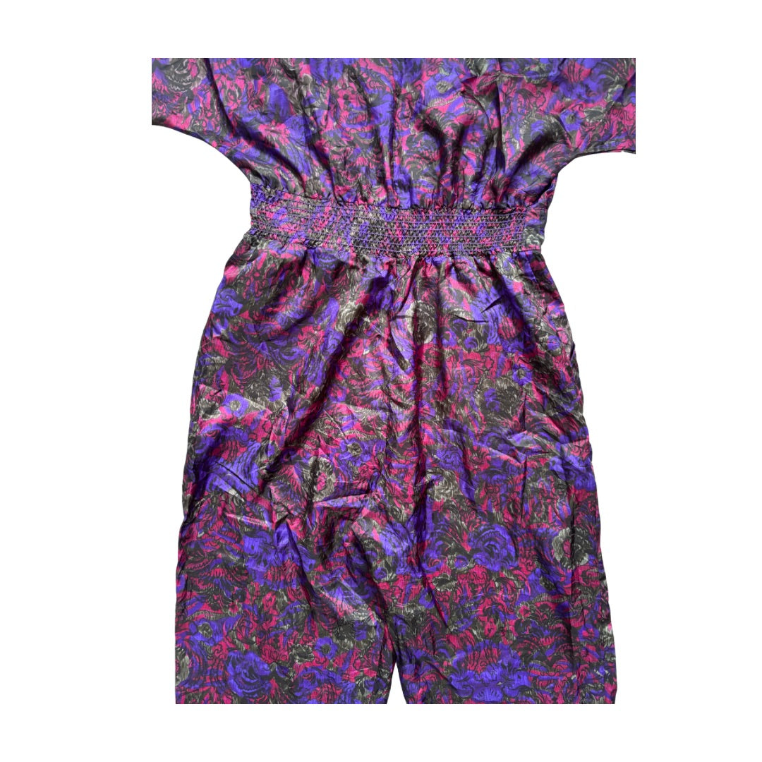 Multicolored patterned jumpsuit on a white background