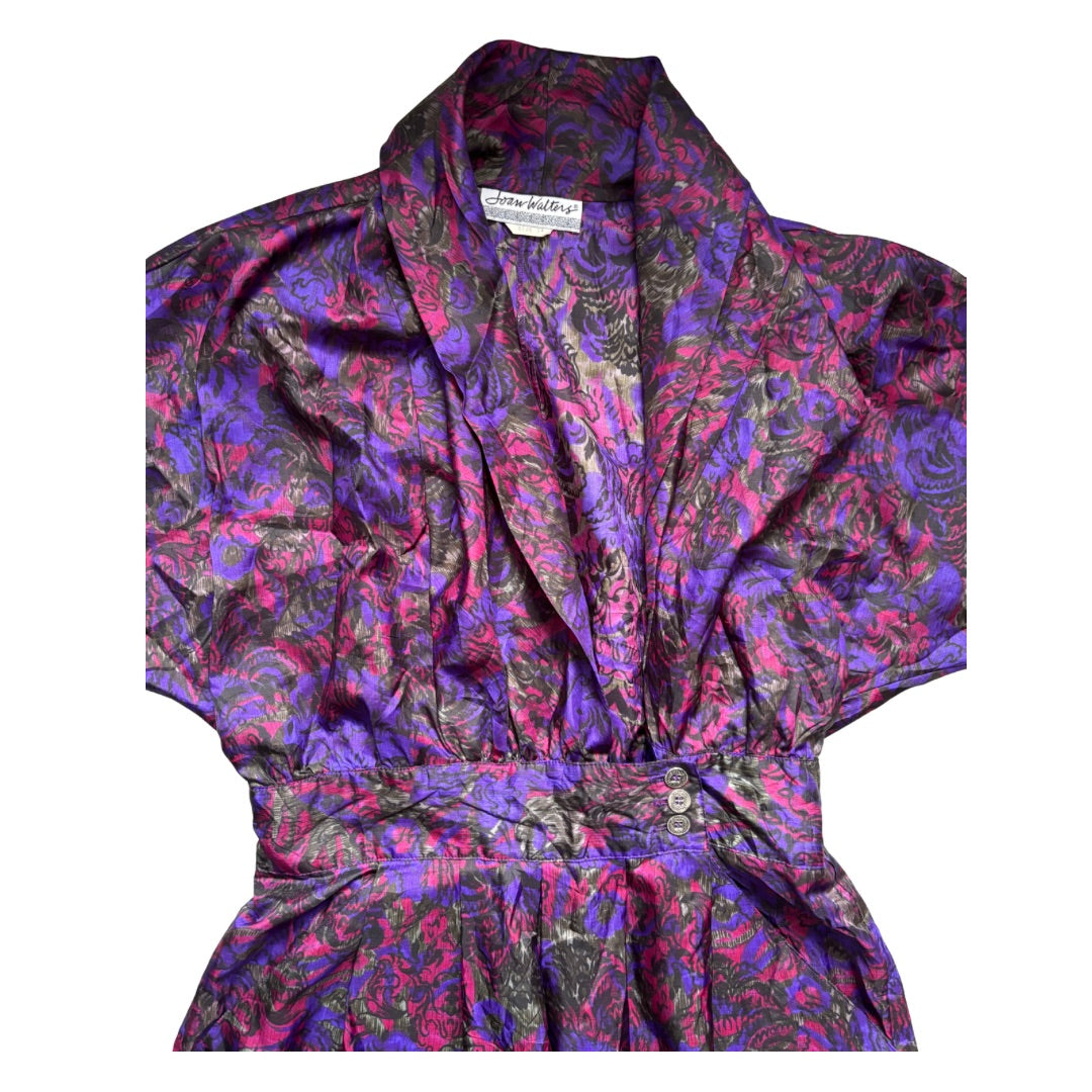 Purple and pink patterned robe on a white background