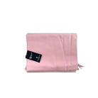 Pink fabric with a tag on a white background