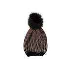 Knitted beanie hat with a black pom-pom on a white background