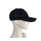 A black knitted mesh baseball cap displayed on a mannequin head.