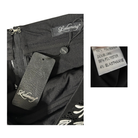 Close-up of a black garment with Lululemon branding, including a tag and label.