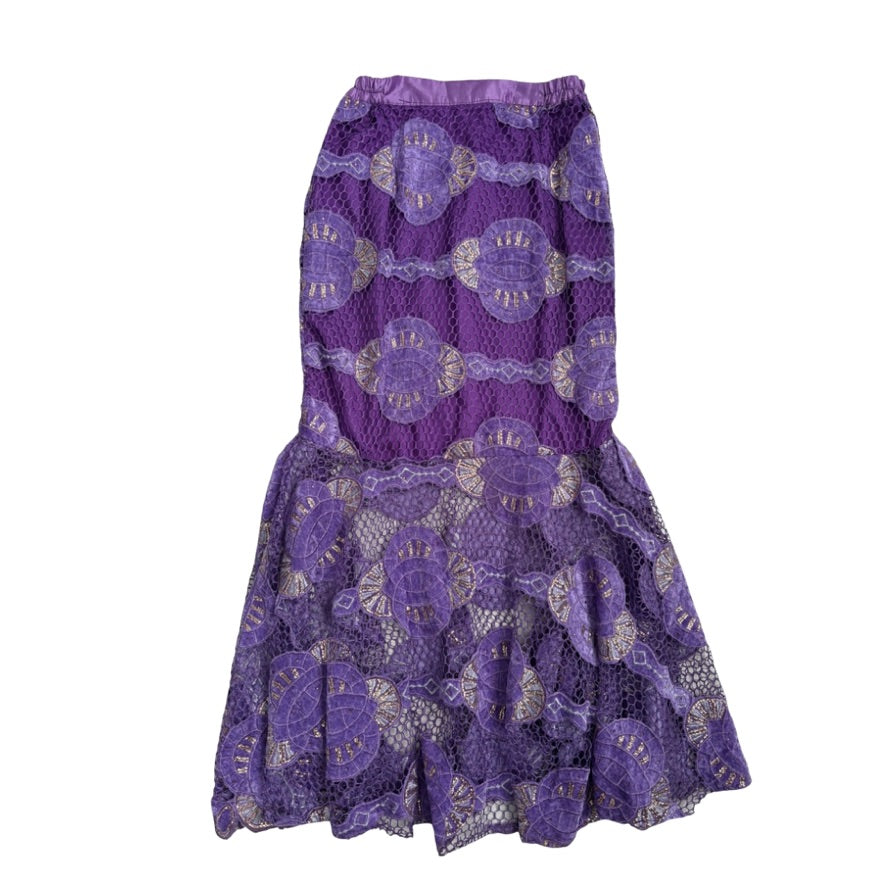 Purple lace dress with floral patterns on a white background