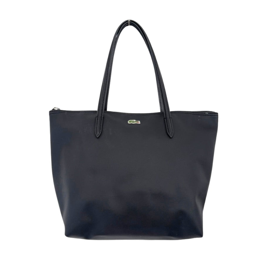 Black tote bag with a visible brand logo on a white background