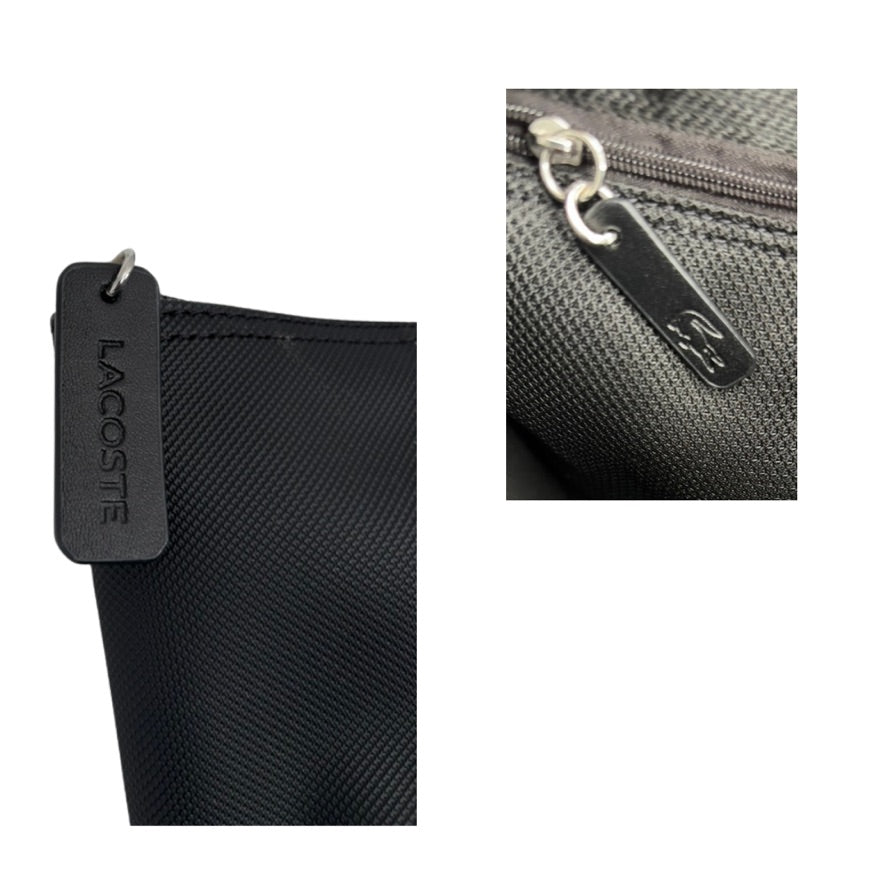 Black bag with Lacoste tag on a white background