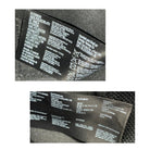 Close-up of a label with text and symbols on a textured surface