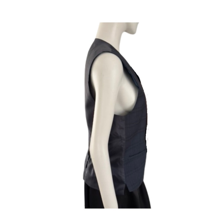 Mannequin wearing a black sleeveless top on a white background