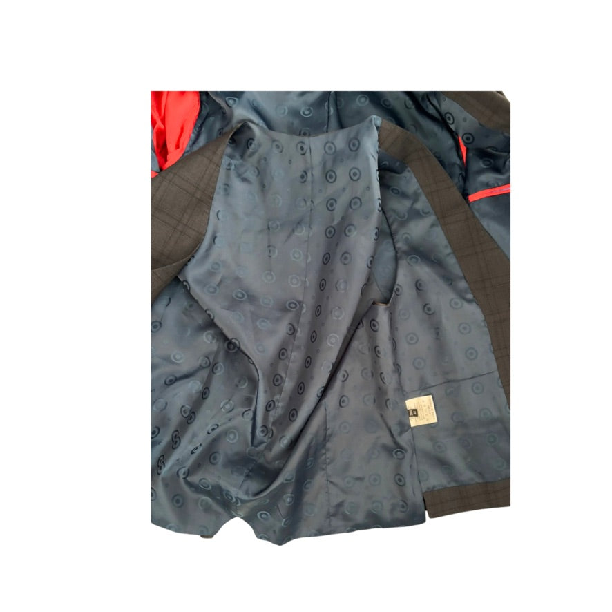 Gray patterned fabric with a gold tag on a white background