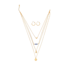 Gold necklace with layered design and a blue gemstone, accompanied by gold hoop earrings on a white background.