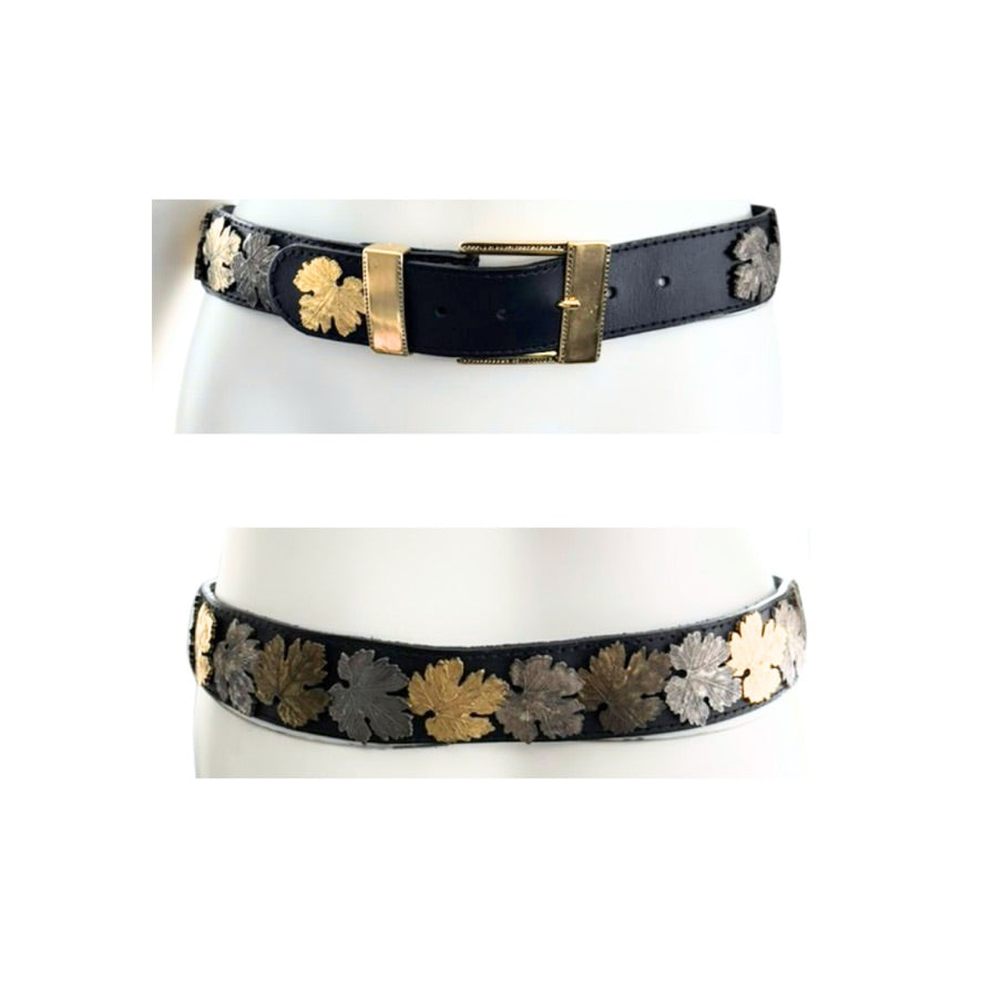Black belt with gold and silver floral patterns on a white background