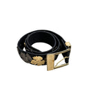 Black belt with gold buckle on a white background