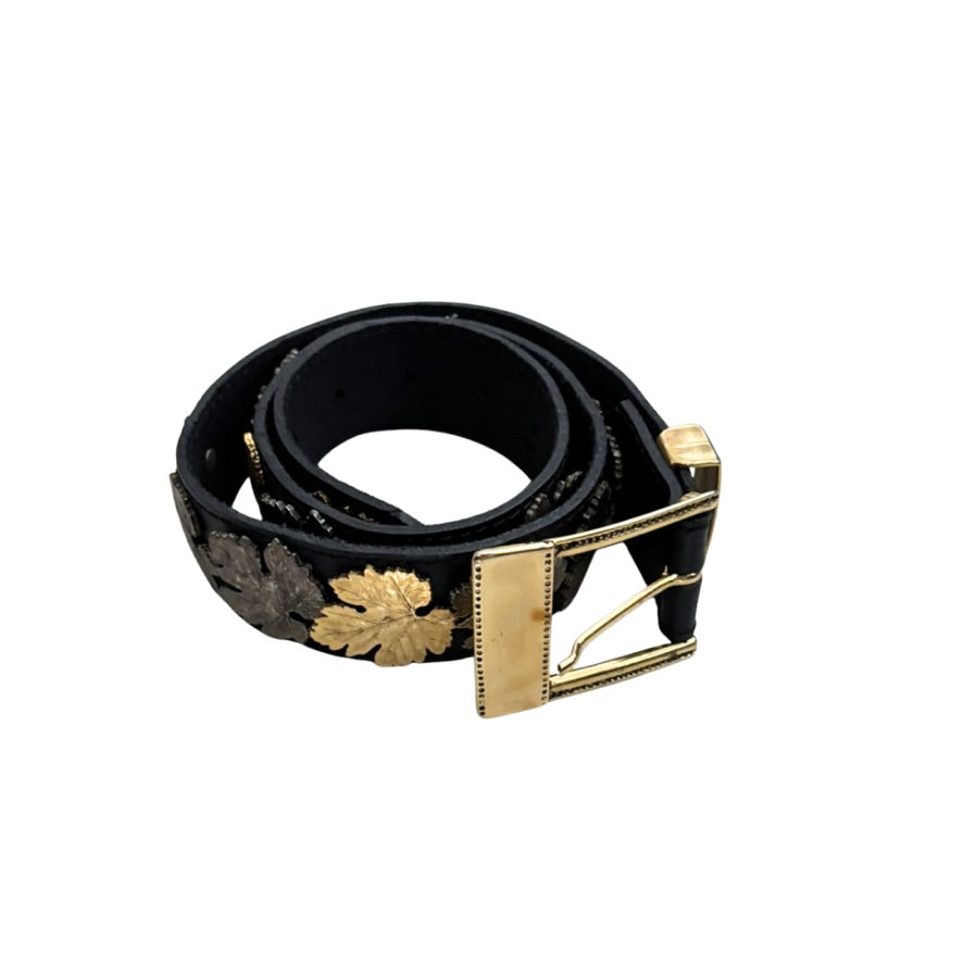 Black belt with gold buckle on a white background