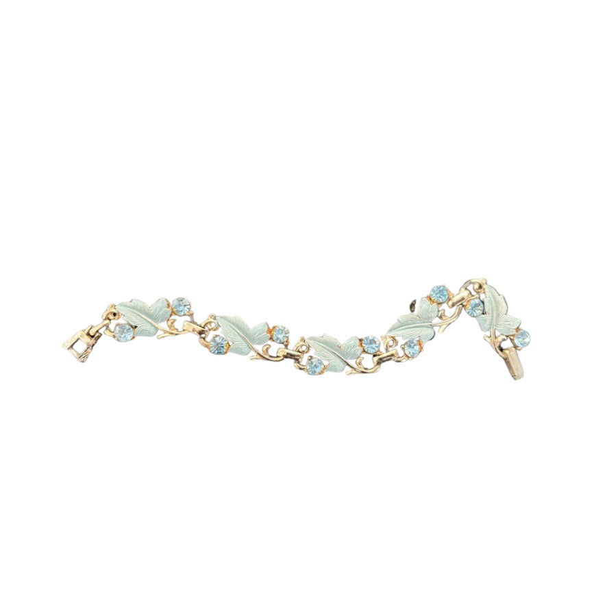 Bracelet with leaf-shaped charms on a white background