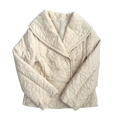 Beige quilted jacket on a white background